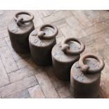 Five early 19th Century cast iron 56lb weights, three dated 1827 and one dated 1820,