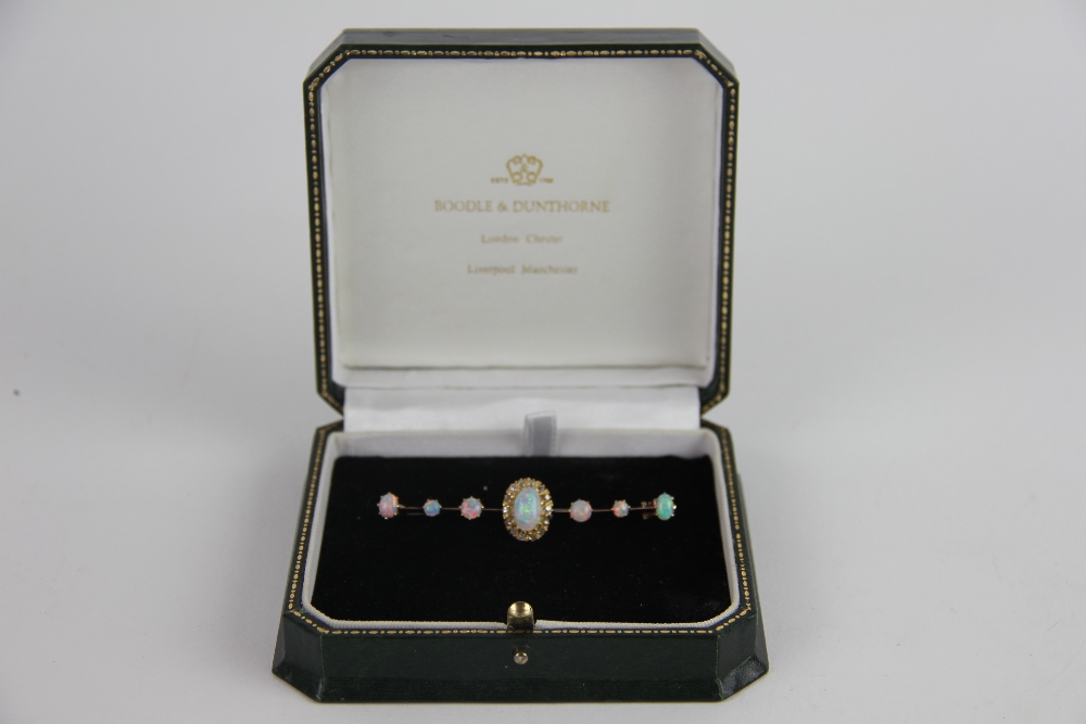 An opal and diamond bar brooch, designed as a central opal and diamond cluster, - Image 2 of 2