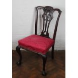 A Chippendale style carved mahogany dining chair, with pierced splat and upholstered seat,