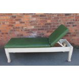 An early 20th Century white painted pine garden lounger, with labe for Cuxson Gerrard Ltd,