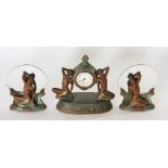 An Art Deco painted spelter time piece garniture, each piece modelled as a female nude,