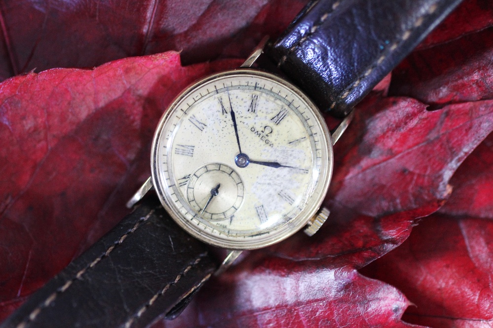 A Lady's 9ct gold Omega wrist watch, with subsidiary seconds and Roman numerals,
