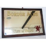 An Edwardian Border Ales Wines of Wales advertising mirror, in oak frame,