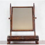 An early 19th Century mahogany toilet mirror, turned and fluted uprights,