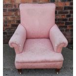 An Edwardian club type chair, with pink foliate upholstery,