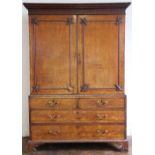 A late George III oak linen press,