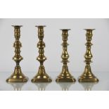 Two pairs of 19th Century brass candlesticks;