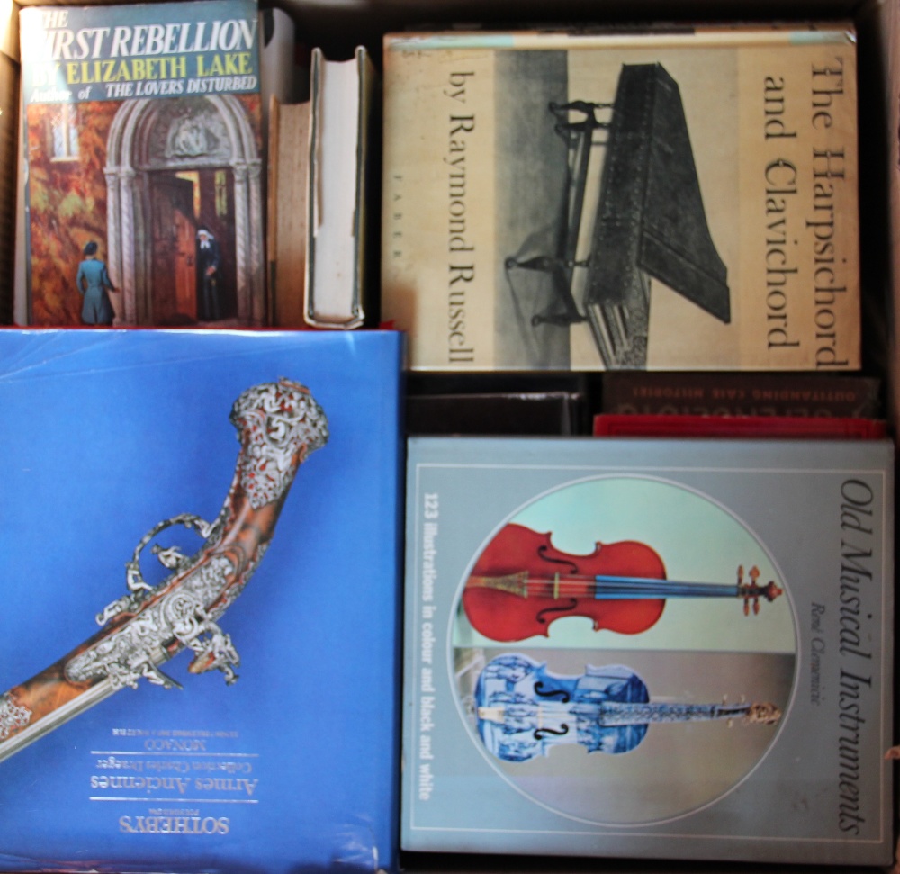 A collection of art and antiques reference books, including arms and armour, musical instruments,