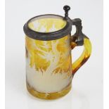 A 19th Century Bohemian engraved amber glass flagon, decorated with a deer in woodland,