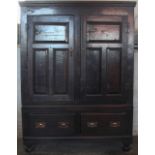 An 18th Century oak livery cupboard, with two panelled doors on later two drawer base, (a/f),