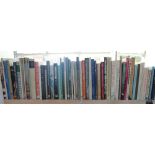 A collection of art history books, including Lowry, Pre Raphaelites,