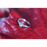 A diamond and aquamarine three stone ring,