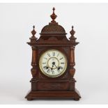 A walnut mantel clock, with painted Roman numeral dial signed Seikosha Tokyo,