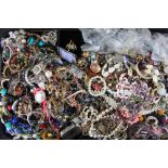 A large quantity of costume jewellery, including rings, brooches,