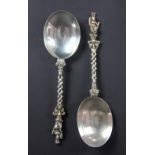 A pair of silver spoons James Wakely and Frank Wheeler, London 1886, each with figural,