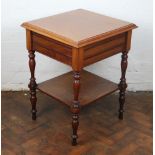 A late Victorian mahogany two tier occasional table, on turned legs,