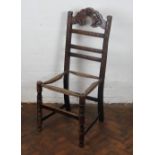 A 19th Century Derbyshire carved oak chair (the set in need of caning)