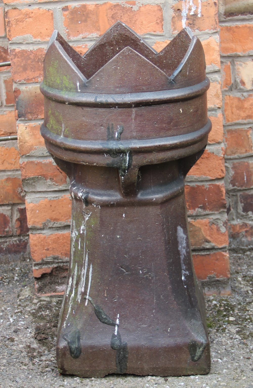 A crown top chimney pot,