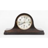 A modern walnut bracket clock, with Roman numeral chapter ring,