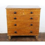 A late Victorian stained pine chest, of two short and three graduated long drawers, on turned feet,