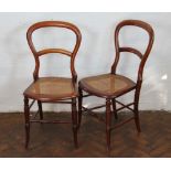 A pair of late Victorian mahogany side chairs, with caned seats,