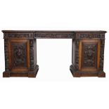 A Victorian carved oak inverted break front sideboard,