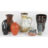 A collection of seven pieces of Art Pottery, to include; a Scheurich jug and oil lamp,