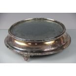 An early 20th century silver plated mirror top cake stand/centrepiece, of concave form,