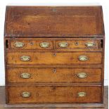 A George III oak bureau, with fall enclosing a fitted interior,