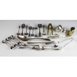 A bag containing a collection of silver teaspoons, forks, coffee spoons, napkin rings,