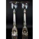 A pair of modern silver plate table centre candlesticks, of early 19th century design and,