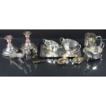 A pair of 19th century silver plated dwarf candlesticks, a sauce boat,