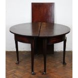 A George III mahogany D end dining table, with one leaf, on tapered legs and pad feet,