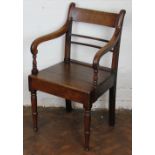 A late George III country oak carver arm chair,