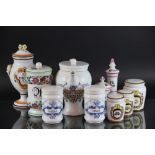 A collection of ten faience apothecary drug jars and covers, to include O.