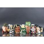 A collection of seven character jugs, to include a Beswick Mr Macawber,