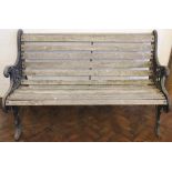 A Victorian coalbrookdale style cast iron garden bench, with slat scroll seat,