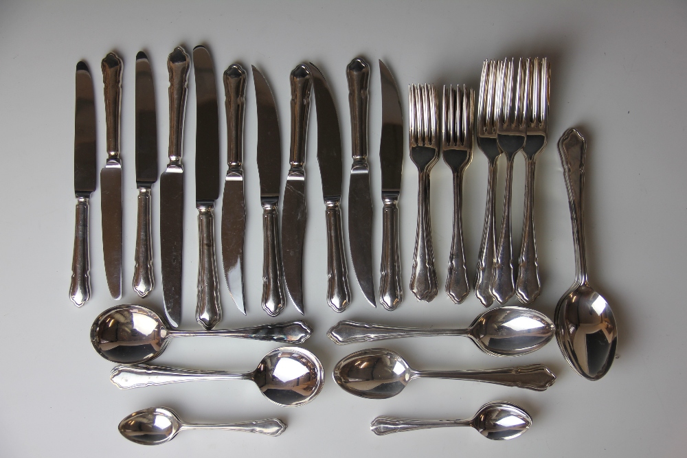 A part suite of silver plate cutlery, comprising twelve dessert spoons, eleven soup spoons,