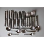 A part suite of silver plate cutlery, comprising twelve dessert spoons, eleven soup spoons,