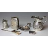 A collection of small silver wares, to include, a silver cream jug with hinged cover,