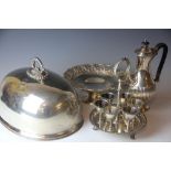 An assortment of silver plate items, to include a Victorian six place cruet set, a meat cover,
