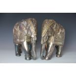 A pair of Indian white metal mounted model elephants,