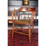 An Edwardian beech and ash tub desk chair,