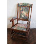 A late 19th century beech American type rocking chair,