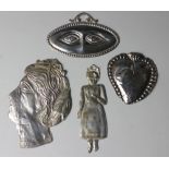 A collection of continental sheet white metal praying figures and body parts,