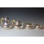 A Victorian silver four piece tea service by John Samuel Hunt, comprising tea pot, hot water pot,