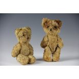 A near pair of teddy bears, circa 1940's, each golden plush bear with jointed limbs, glass eyes,