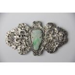 A Chinese silver and jade set buckle, decorated with two dragons within a foliate border, 8.