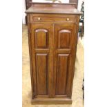 An Edwardian mahogany music cabinet, with corner angle draw,