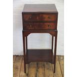 An Edwardian mahogany bedside cabinet, with two drawers and undertier on tapered legs, 87cm H x 40.